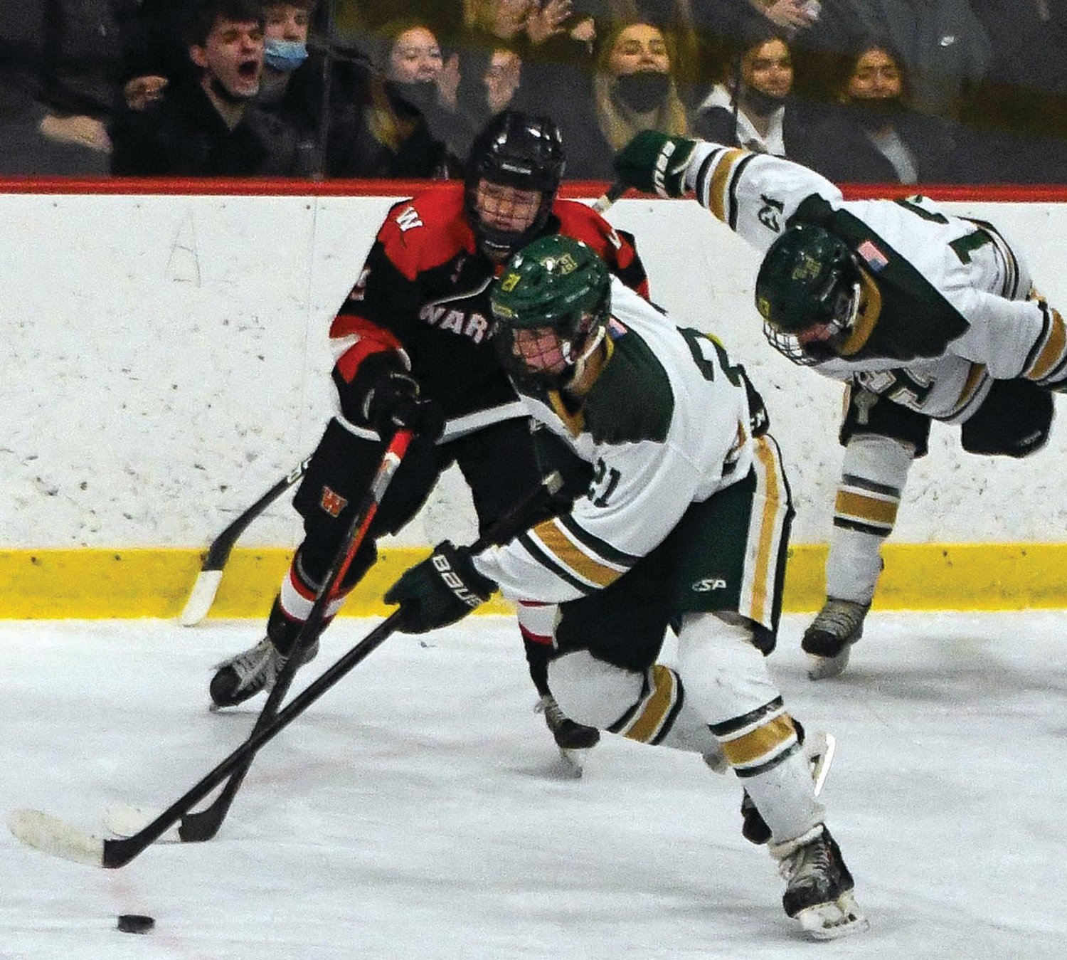 UP THE ICE: Bishop Hendricken’s Will Cavanagh takes the puck up the ice last week.